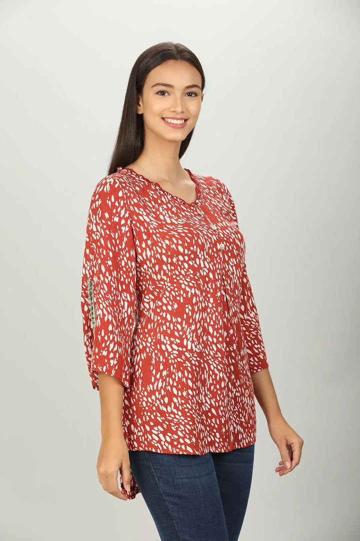 Red abstract print V neck Top