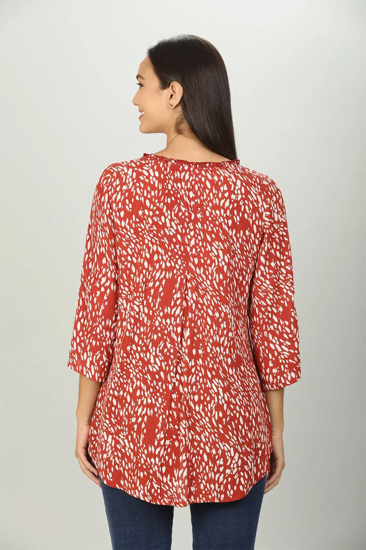 Red abstract print V neck Top