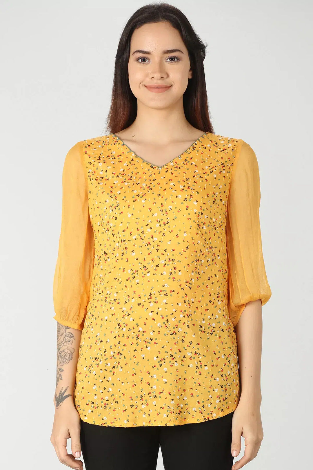 Yellow v-neck top with ditsy print