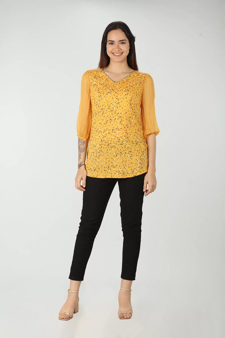 Yellow v-neck top with ditsy print