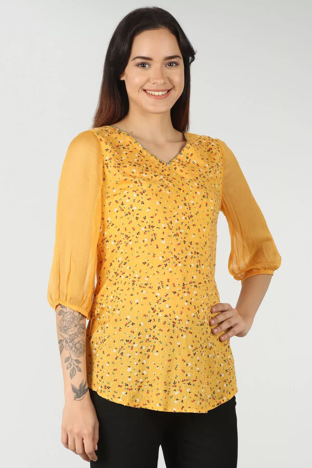 Yellow v-neck top with ditsy print