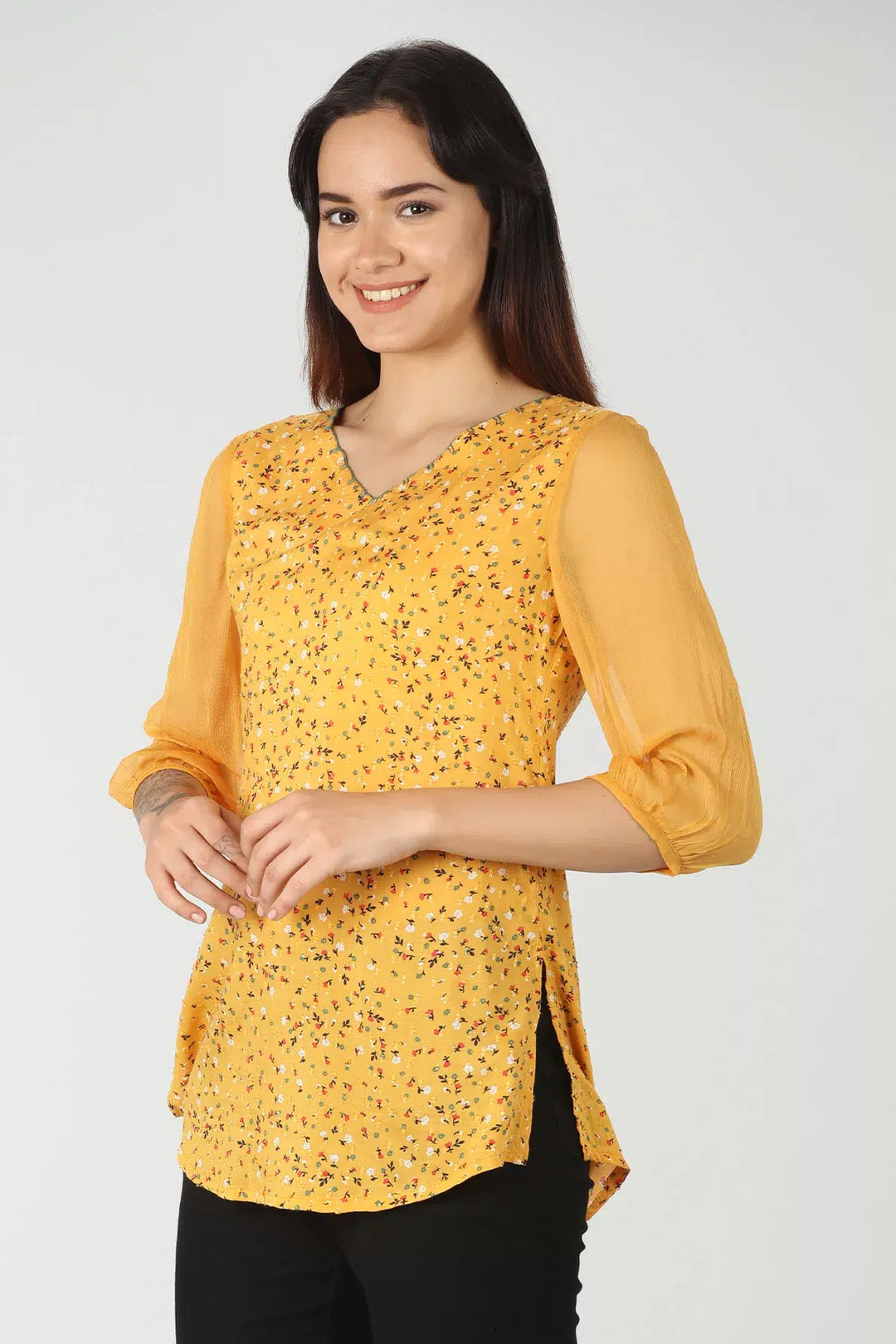 Yellow v-neck top with ditsy print