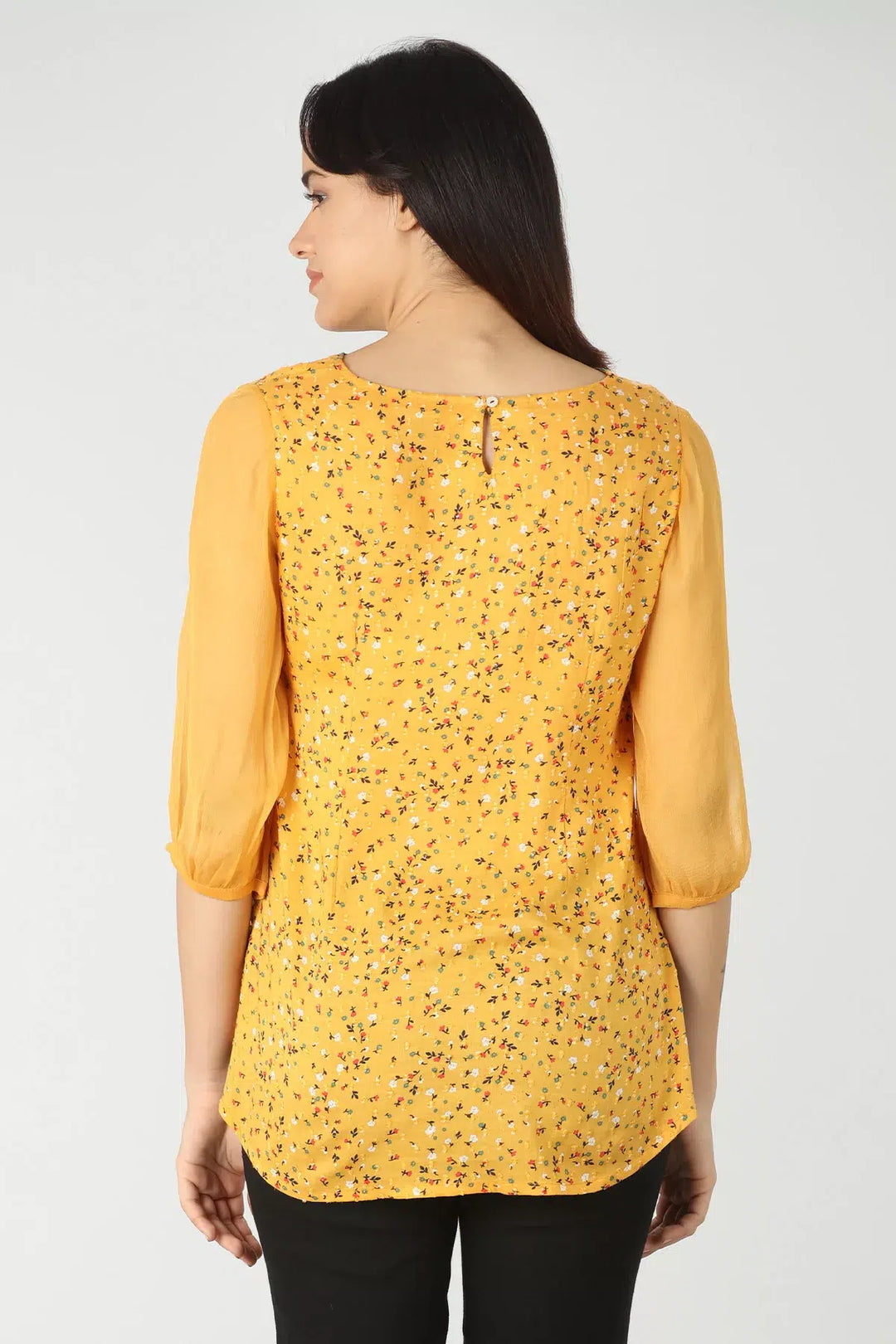 Yellow v-neck top with ditsy print