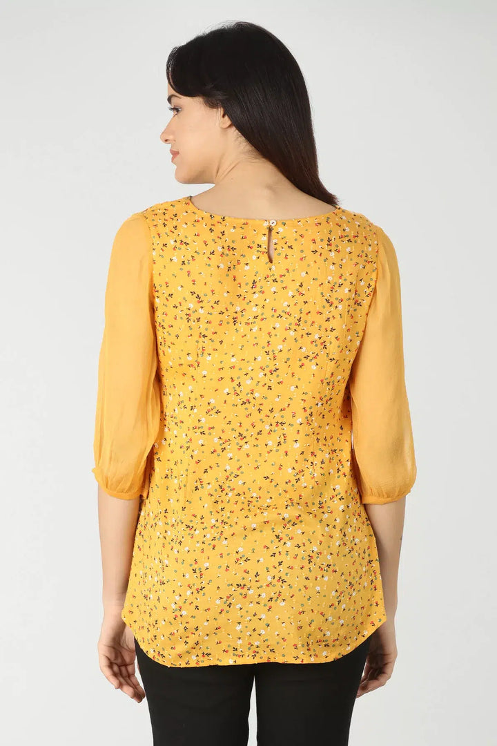 Yellow v-neck top with ditsy print