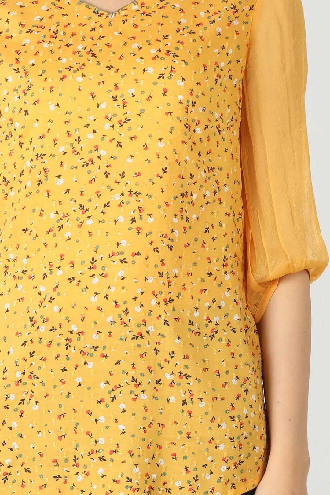 Yellow v-neck top with ditsy print