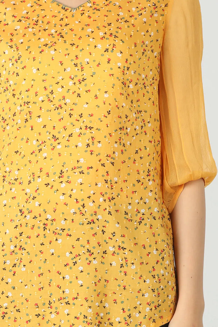 Yellow v-neck top with ditsy print