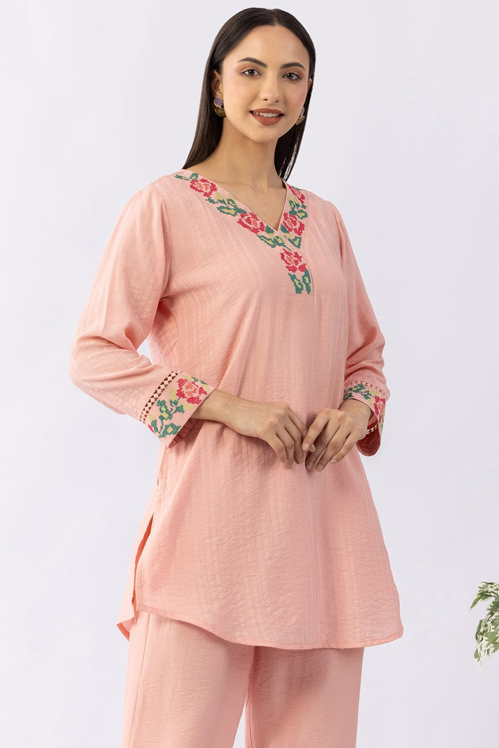 Peach co-ord set for women with embroidered V neck top and pants