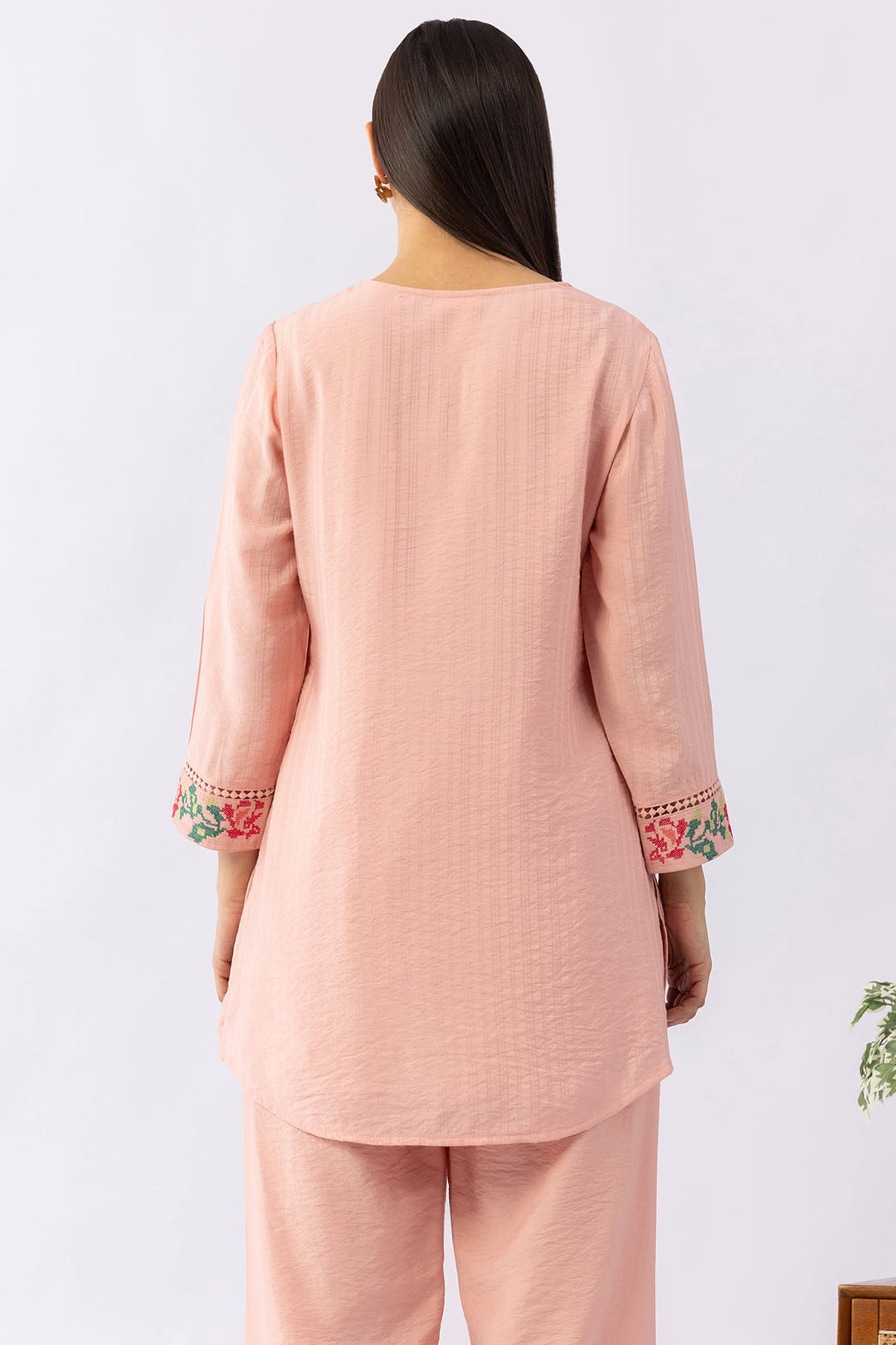 Peach co-ord set for women with embroidered V neck top and pants