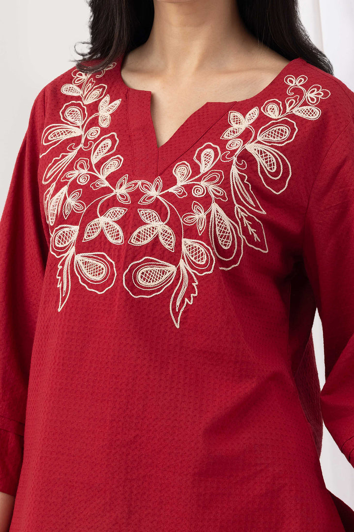 Red top for women with embroidered detailing