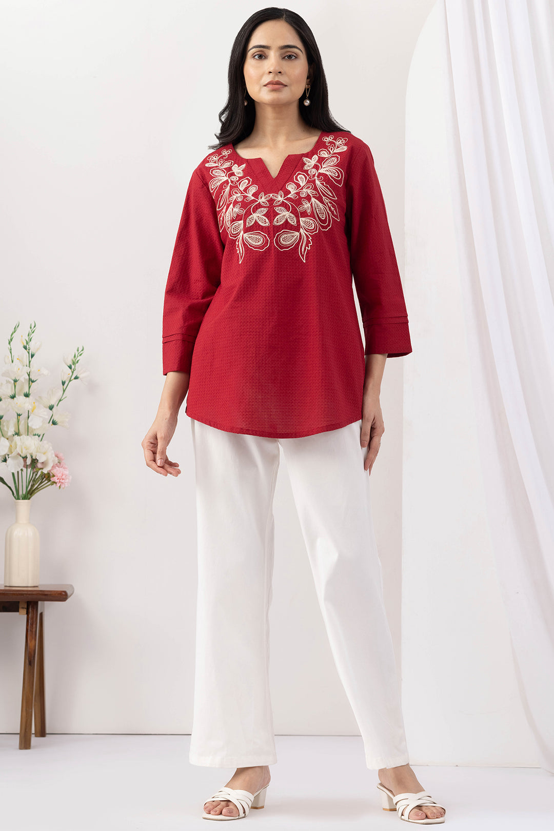 Red top for women with embroidered detailing