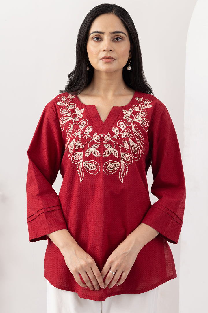 Red top for women with embroidered detailing