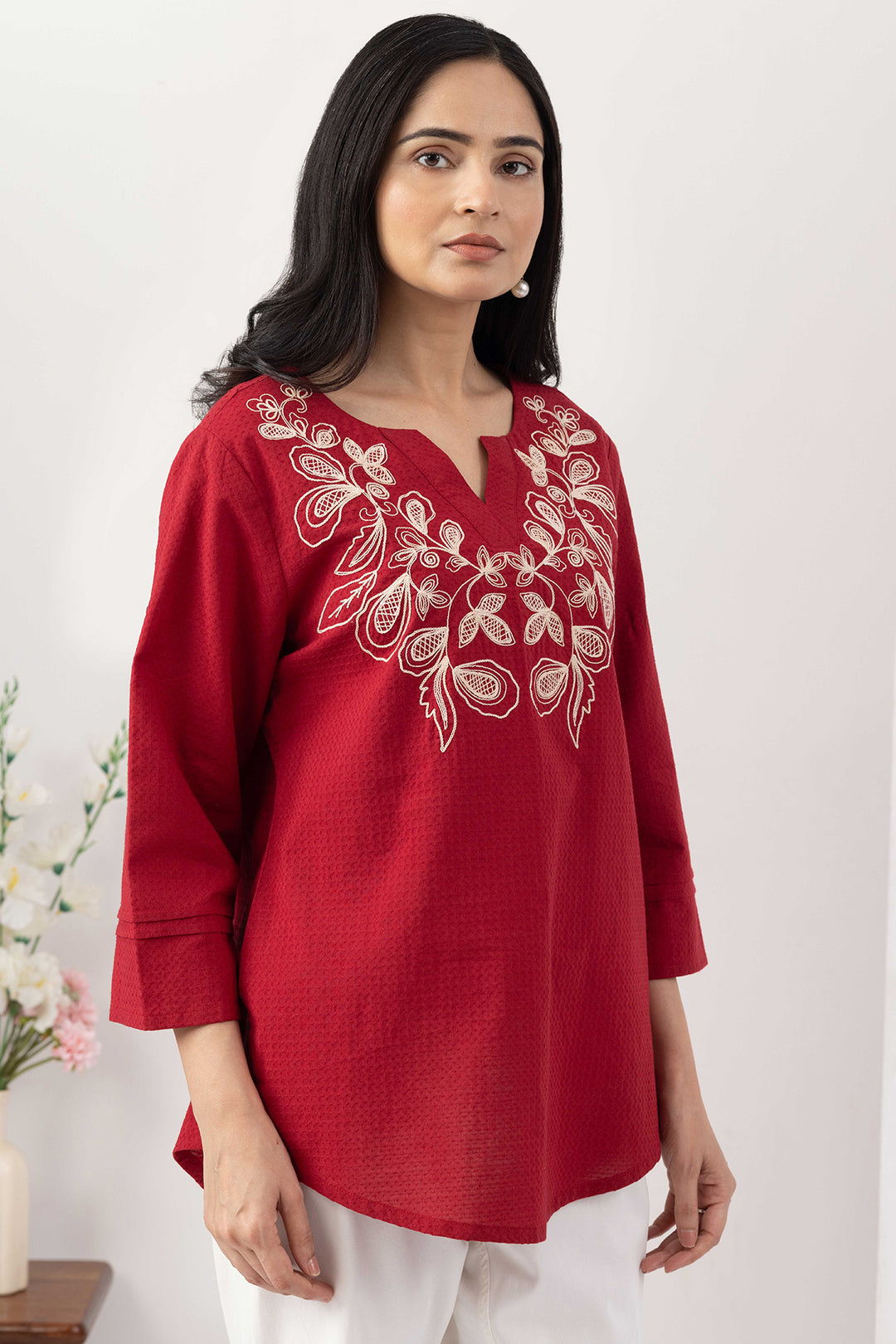 Red top for women with embroidered detailing