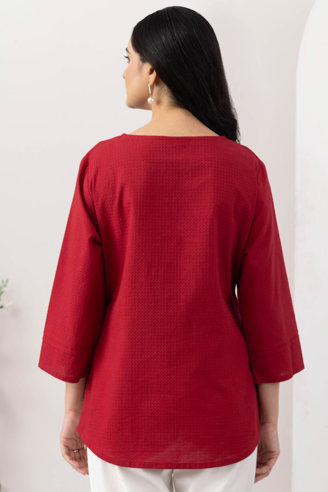 Red top for women with embroidered detailing