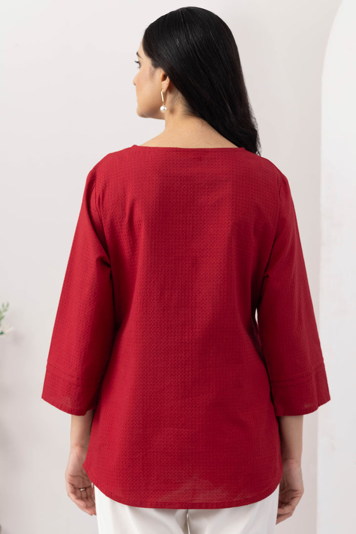Red top for women with embroidered detailing