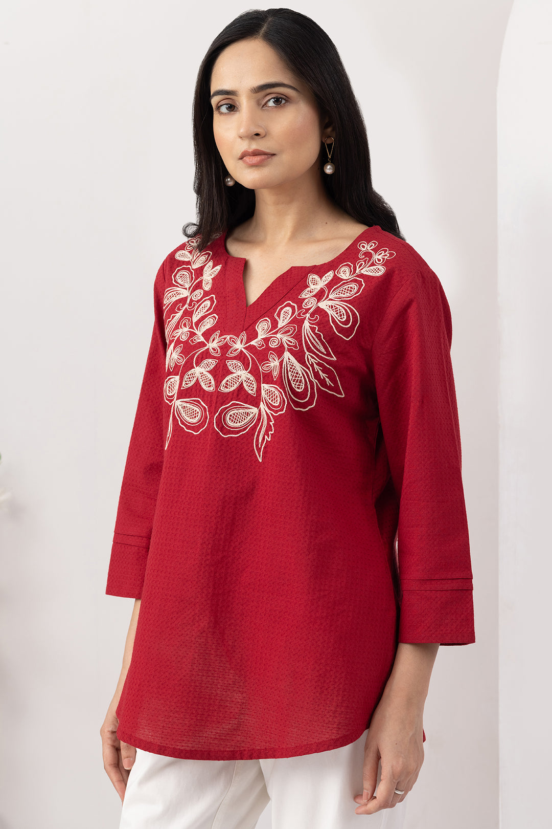Red top for women with embroidered detailing