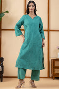 Front view of a woman wearing a pure cotton kurta set for women in green with V-neck embroidery in regular and plus sizes