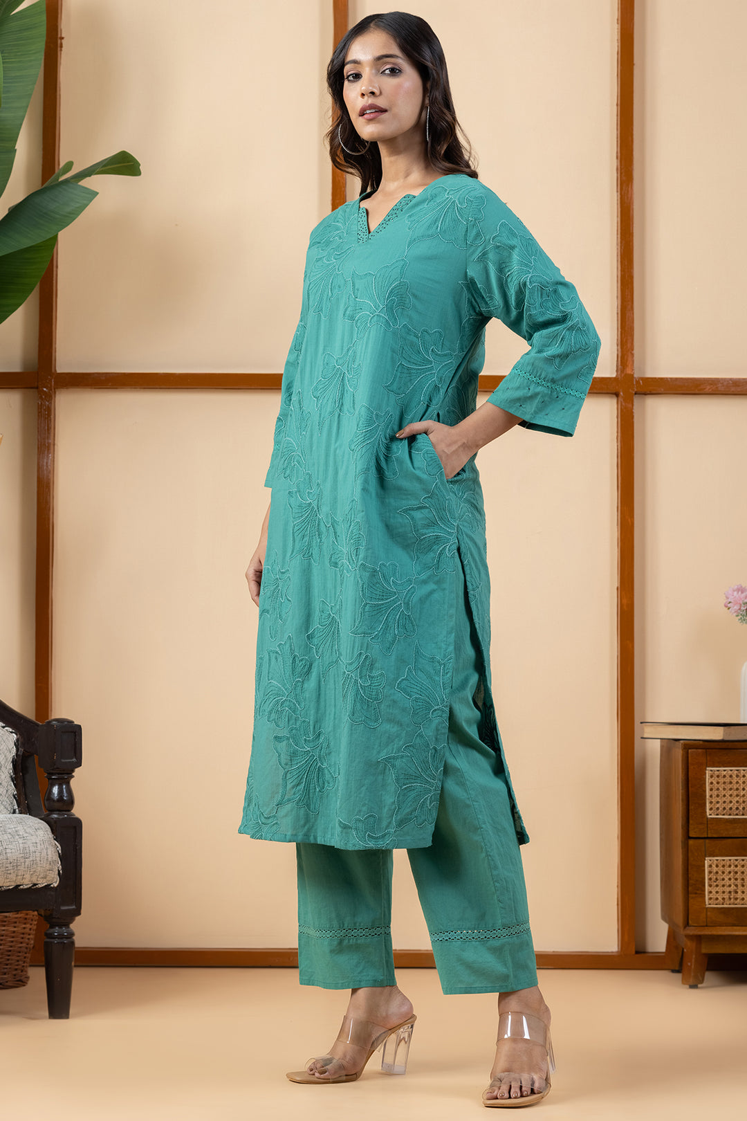 Side profile view showing the regular fit drape of the green cotton kurta and matching pants
