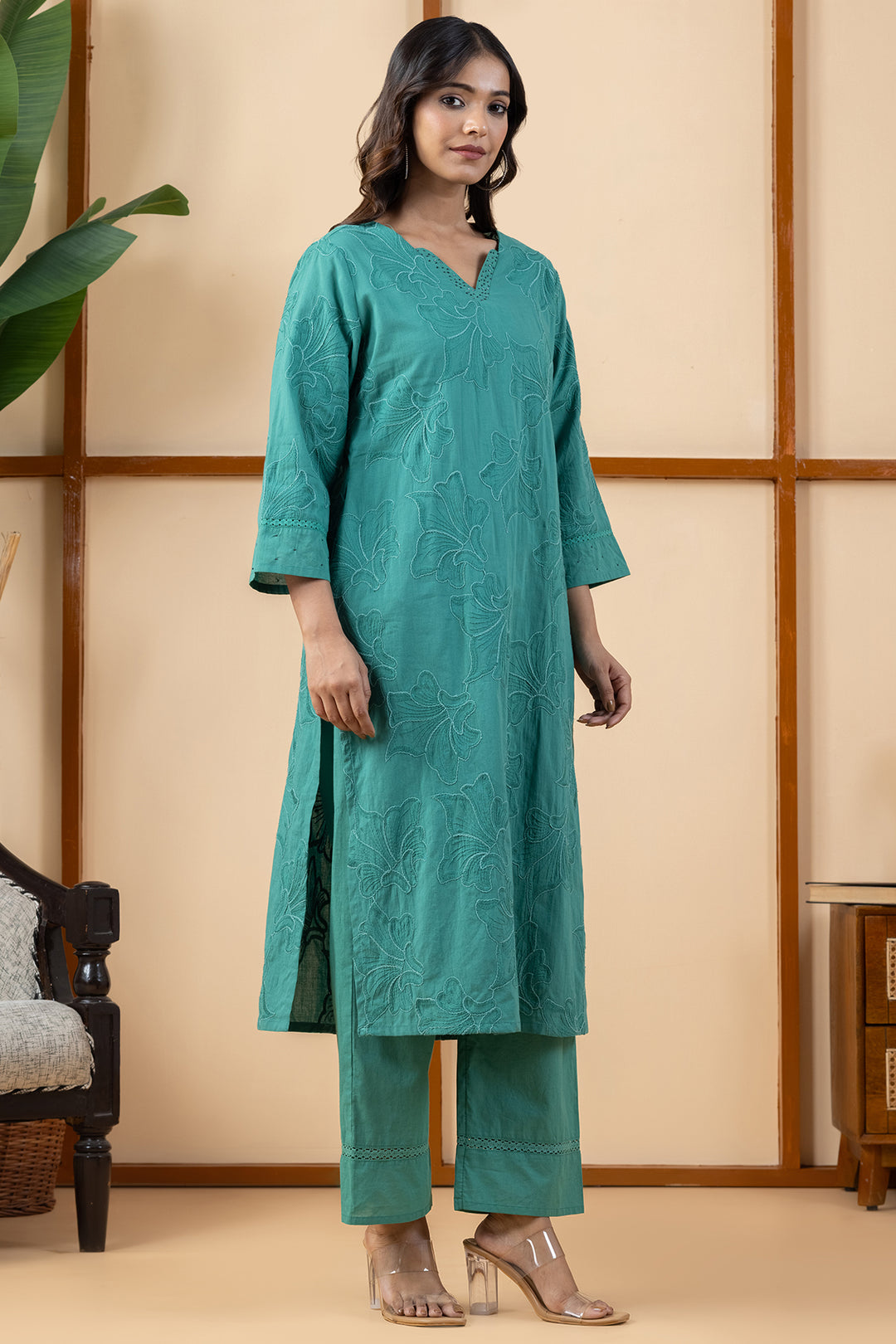 Side profile view showing the regular fit drape of the green cotton kurta and matching pants